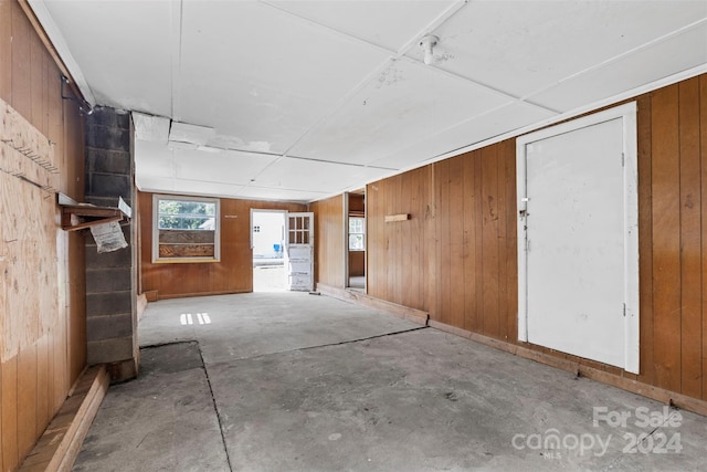 interior space featuring wood walls