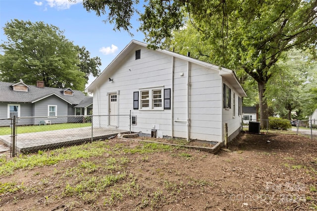 back of property featuring cooling unit