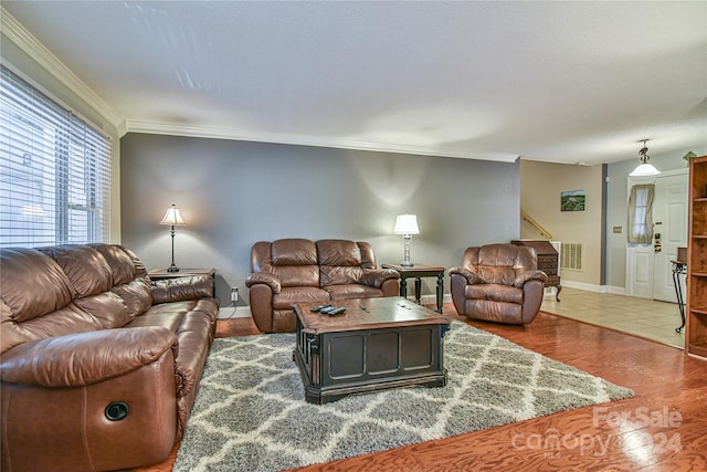 living room with crown molding and dark wood-type flooring