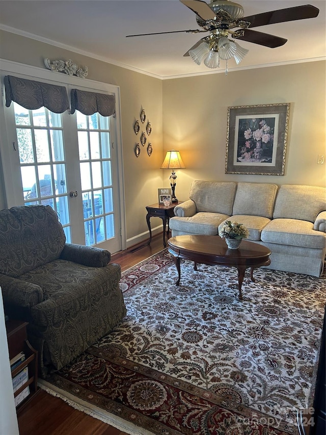 living room with ornamental molding, hardwood / wood-style floors, ceiling fan, and french doors