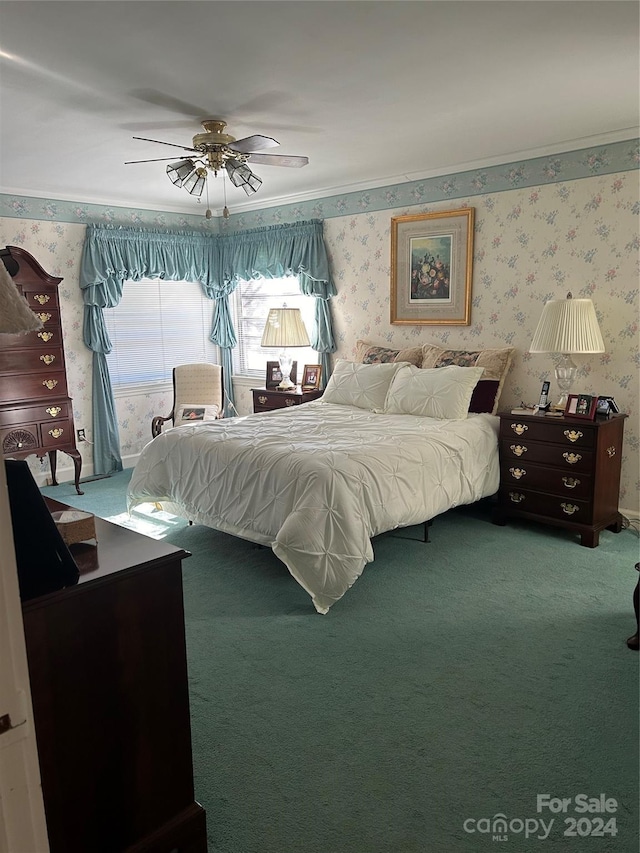 bedroom featuring crown molding, ceiling fan, and carpet floors