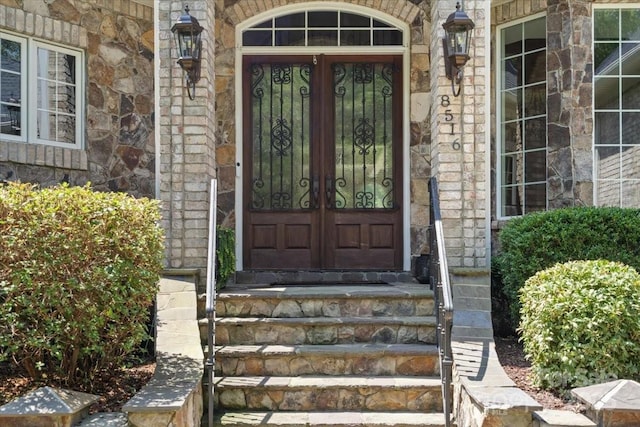 property entrance featuring french doors