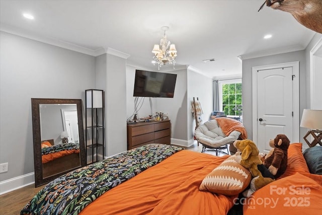 bedroom with an inviting chandelier, ornamental molding, and dark hardwood / wood-style flooring