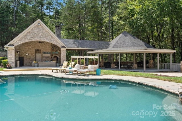 view of pool featuring a gazebo, an outdoor hangout area, and a patio area