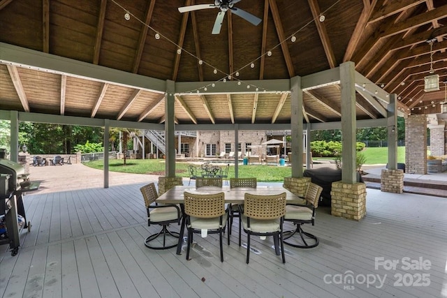 wooden deck featuring a gazebo and ceiling fan