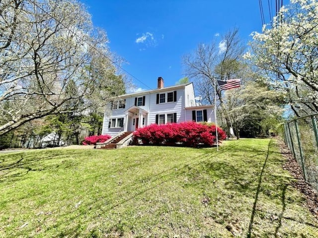 view of front of home with a front yard