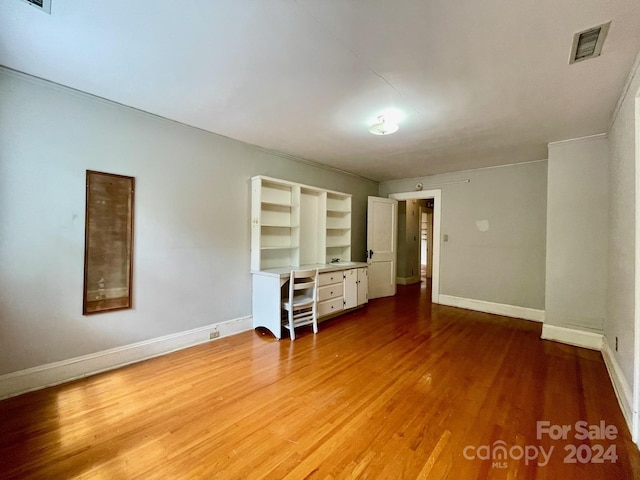 unfurnished bedroom with wood-type flooring