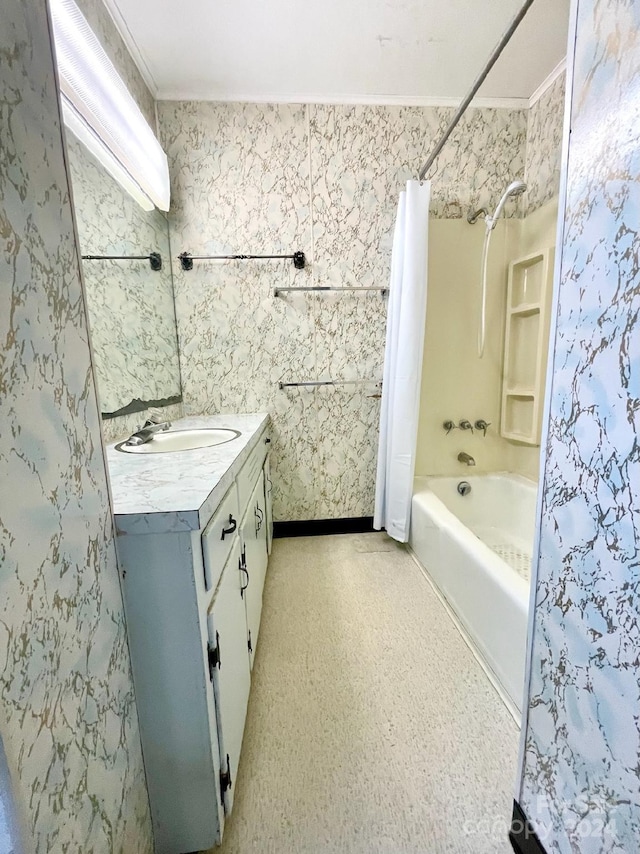 bathroom featuring shower / bath combo, ornamental molding, and vanity