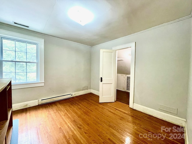 unfurnished bedroom featuring hardwood / wood-style flooring