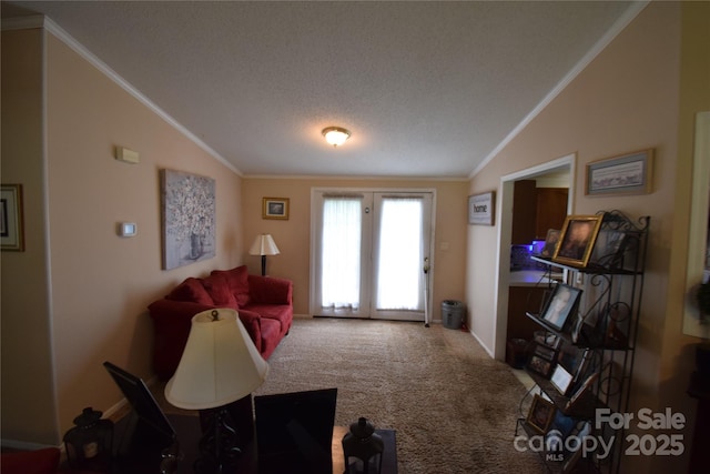 living room featuring carpet, french doors, a textured ceiling, crown molding, and lofted ceiling