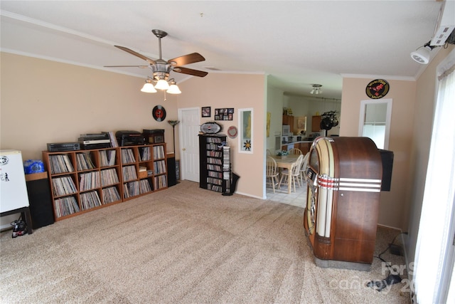 misc room with light carpet, vaulted ceiling, ceiling fan, and ornamental molding