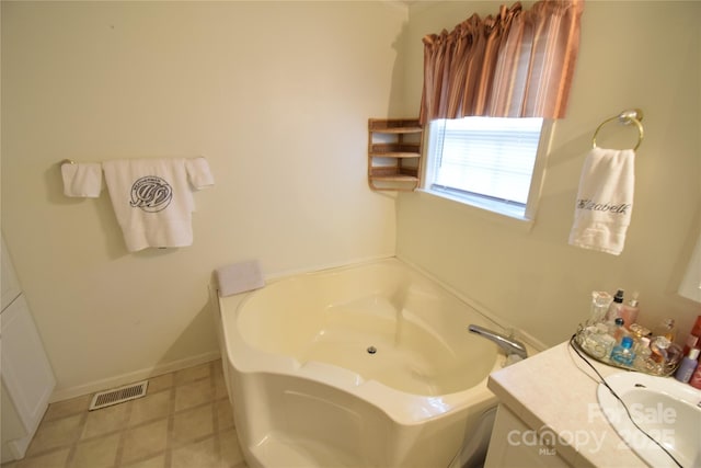 bathroom with vanity and a bathing tub