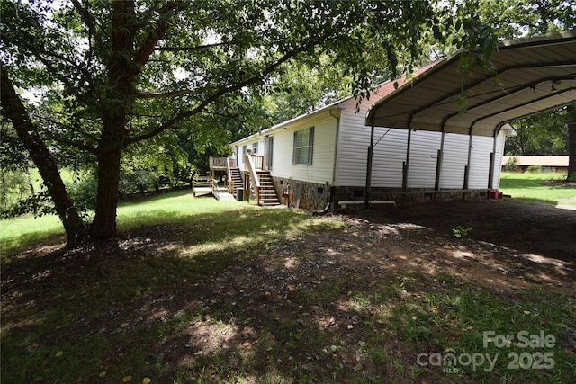 view of side of home with a yard