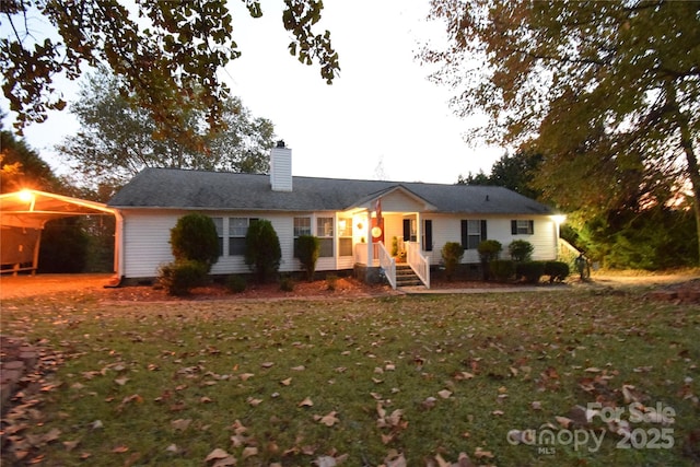 ranch-style home with a front lawn