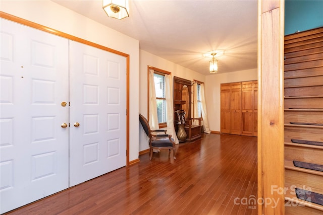 foyer entrance with hardwood / wood-style floors