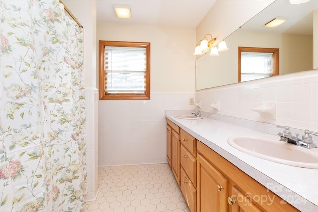 bathroom featuring double sink vanity, tile walls, decorative backsplash, and tile patterned flooring