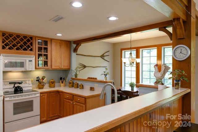 kitchen with white appliances, brown cabinetry, glass insert cabinets, light countertops, and pendant lighting