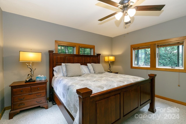 bedroom with light colored carpet and ceiling fan