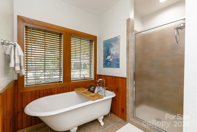 bathroom featuring plus walk in shower and tile patterned floors