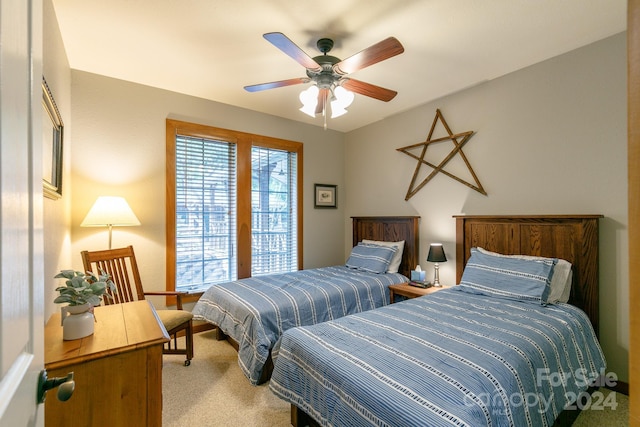 bedroom with carpet and a ceiling fan