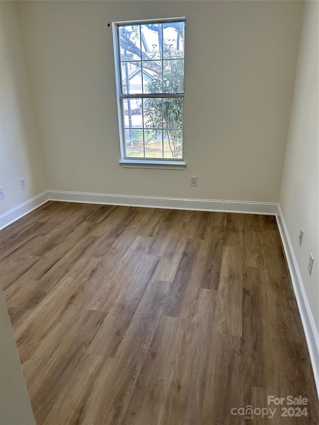 empty room featuring hardwood / wood-style flooring