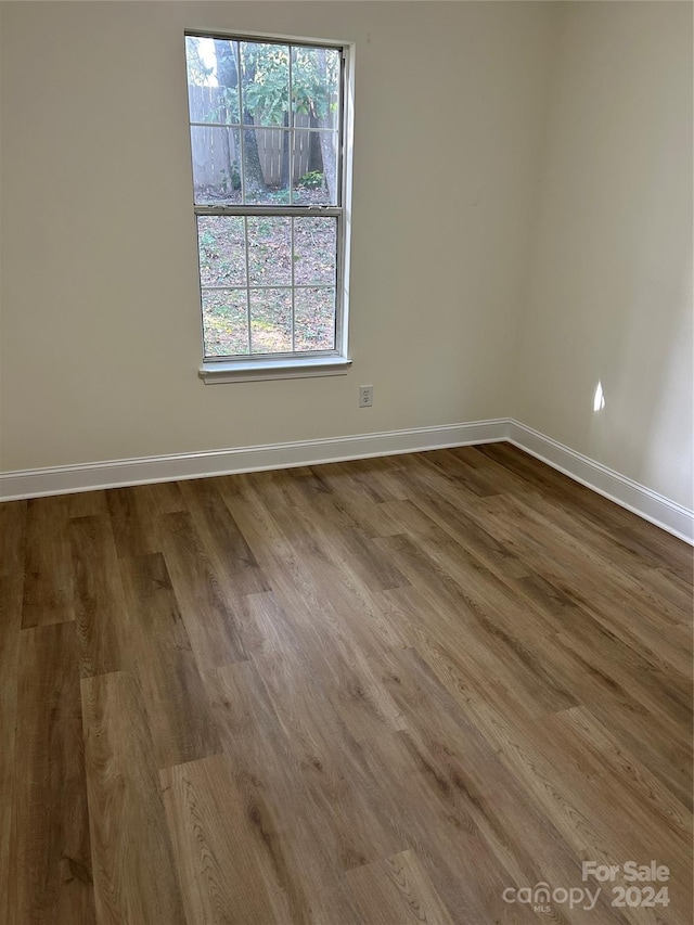 empty room with wood-type flooring