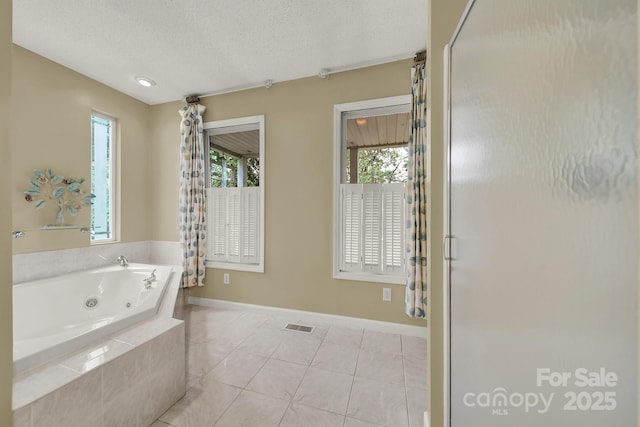 9143 Sadlers Ridge Rd, Fort Mill, SC 29707 - full bath with a whirlpool tub, a textured ceiling, tile patterned floors, and baseboards