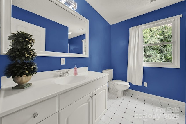 9143 Sadlers Ridge Rd, Fort Mill, SC 29707 - half bath featuring toilet, vanity, baseboards, and tile patterned floors