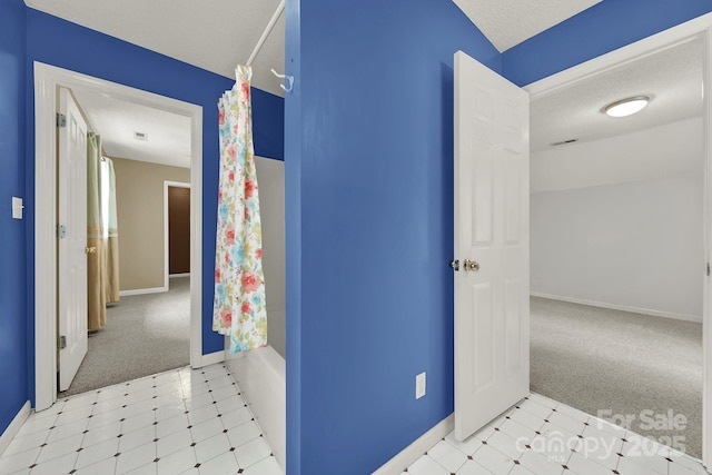 9143 Sadlers Ridge Rd, Fort Mill, SC 29707 - bathroom with baseboards, tile patterned floors, a textured ceiling, and shower / tub combo