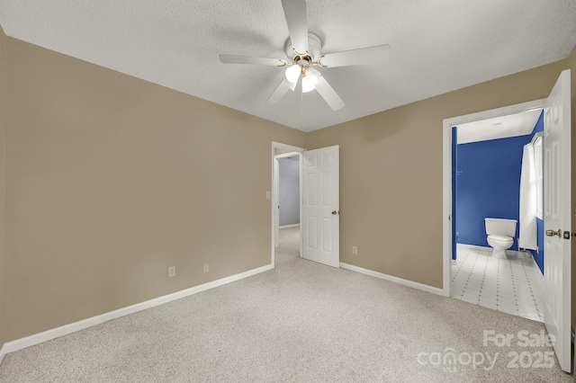 9143 Sadlers Ridge Rd, Fort Mill, SC 29707 - unfurnished bedroom with carpet flooring, baseboards, a textured ceiling, ceiling fan, and ensuite bath