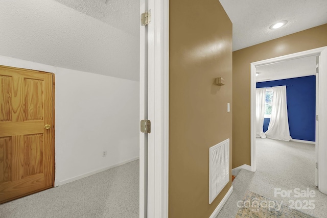 9143 Sadlers Ridge Rd, Fort Mill, SC 29707 - corridor with carpet floors, a textured ceiling, and baseboards