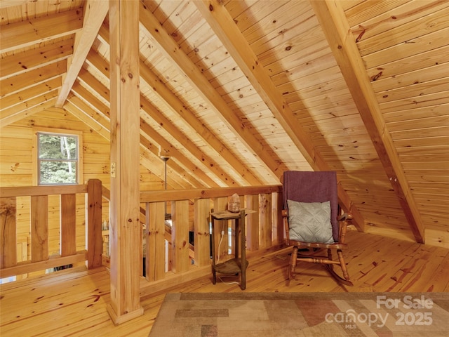 bonus room featuring lofted ceiling with beams, wood ceiling, and light hardwood / wood-style floors