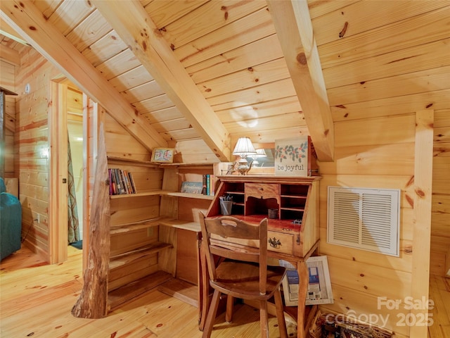 interior space with wood ceiling, wood-type flooring, lofted ceiling with beams, and wooden walls