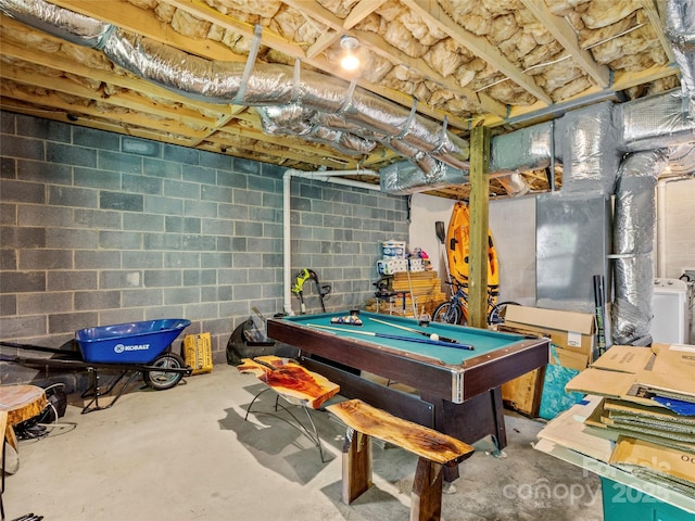 game room with pool table, concrete flooring, and washer / clothes dryer