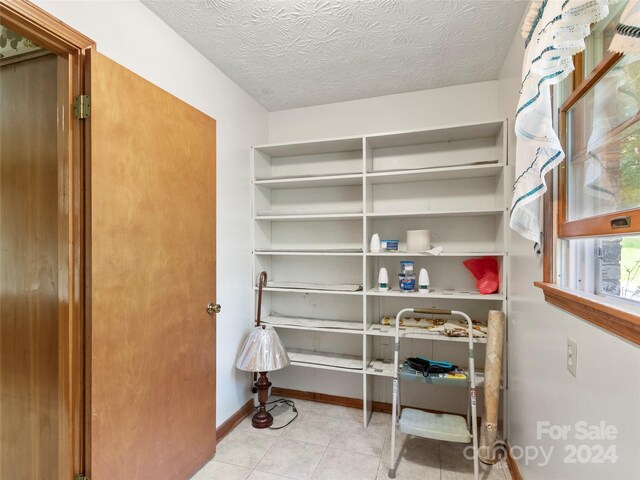 interior space featuring light tile patterned flooring