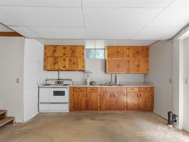 kitchen with electric range and a paneled ceiling