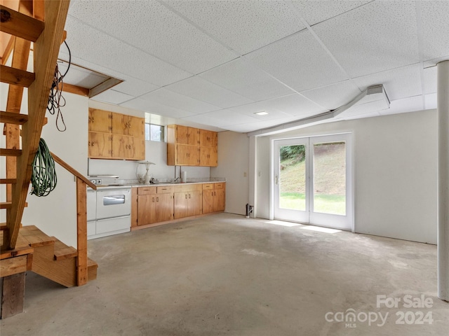 kitchen featuring a paneled ceiling and electric stove