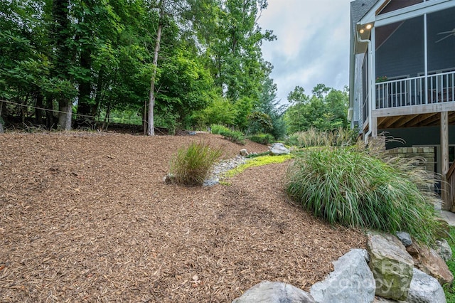 view of yard featuring a sunroom