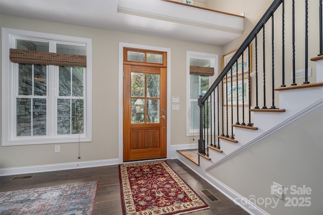 foyer with dark hardwood / wood-style flooring