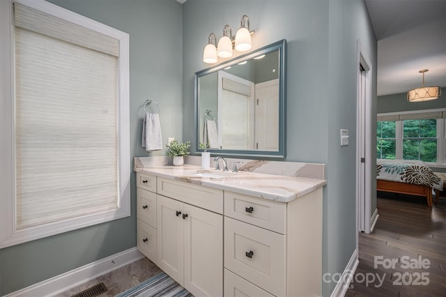 bathroom featuring vanity and hardwood / wood-style flooring