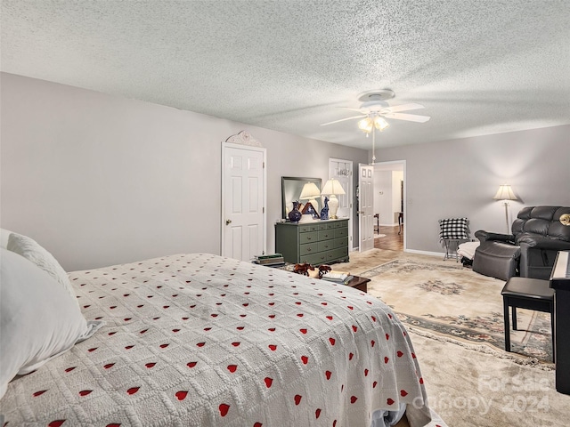 bedroom featuring a textured ceiling and ceiling fan