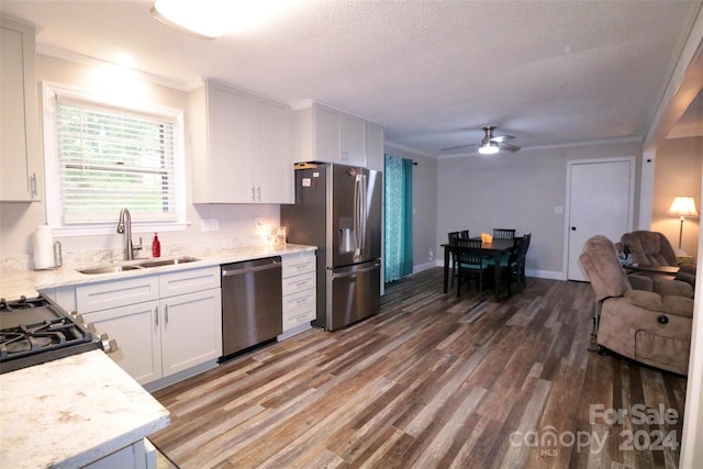 kitchen featuring sink, dark hardwood / wood-style flooring, ceiling fan, stainless steel appliances, and white cabinets