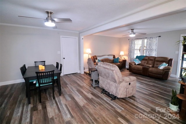 living area with a ceiling fan, crown molding, baseboards, and wood finished floors