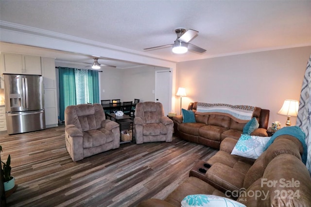 living room with ceiling fan, ornamental molding, and wood finished floors