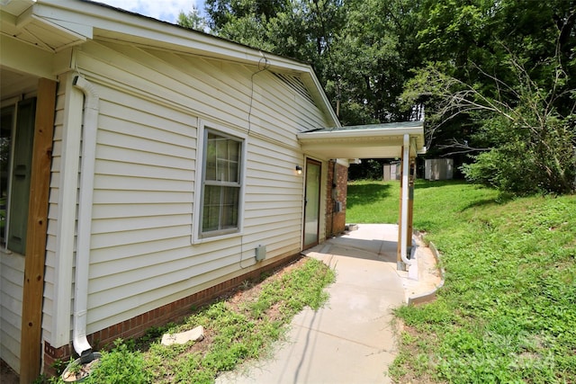 view of home's exterior with a yard