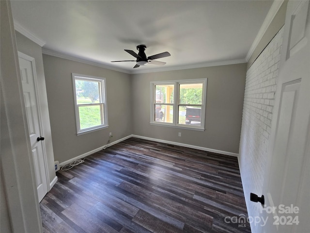 unfurnished bedroom with a ceiling fan, baseboards, ornamental molding, and dark wood-style floors