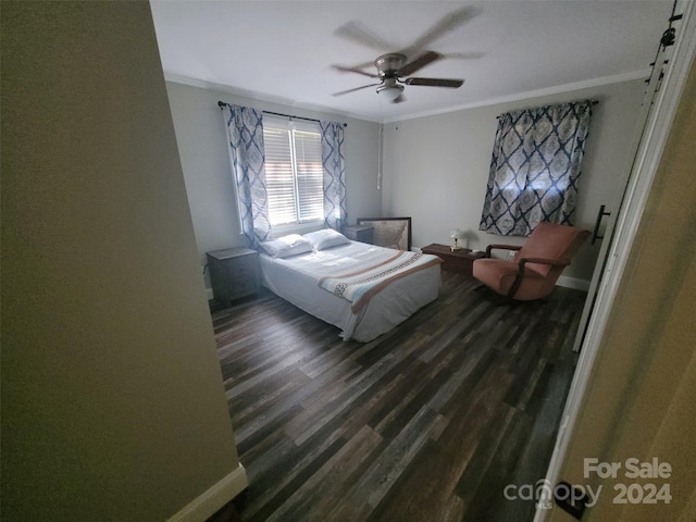 bedroom with dark wood-style floors, ornamental molding, a ceiling fan, and baseboards