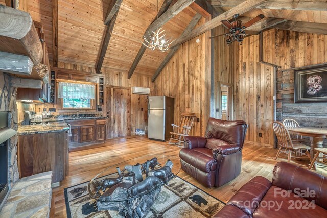 living room featuring wood walls, beam ceiling, hardwood / wood-style floors, and wood ceiling