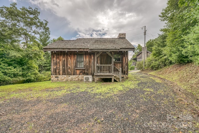 view of front of home featuring board and batten siding and a chimney