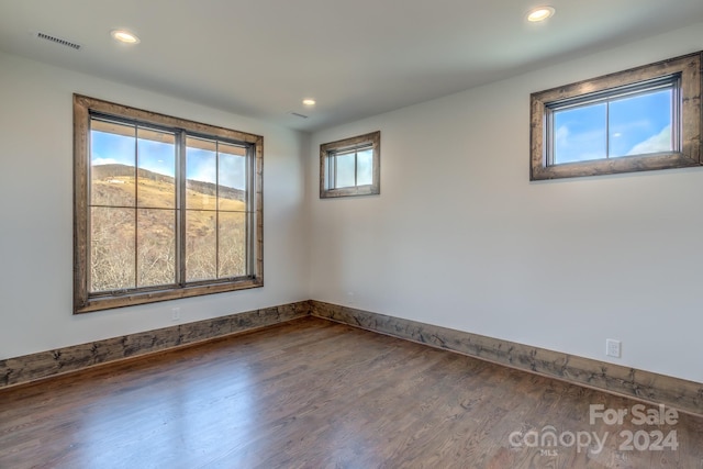 empty room featuring hardwood / wood-style flooring